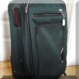 Z04. Travel Pro green canvas rolling bag - $20 